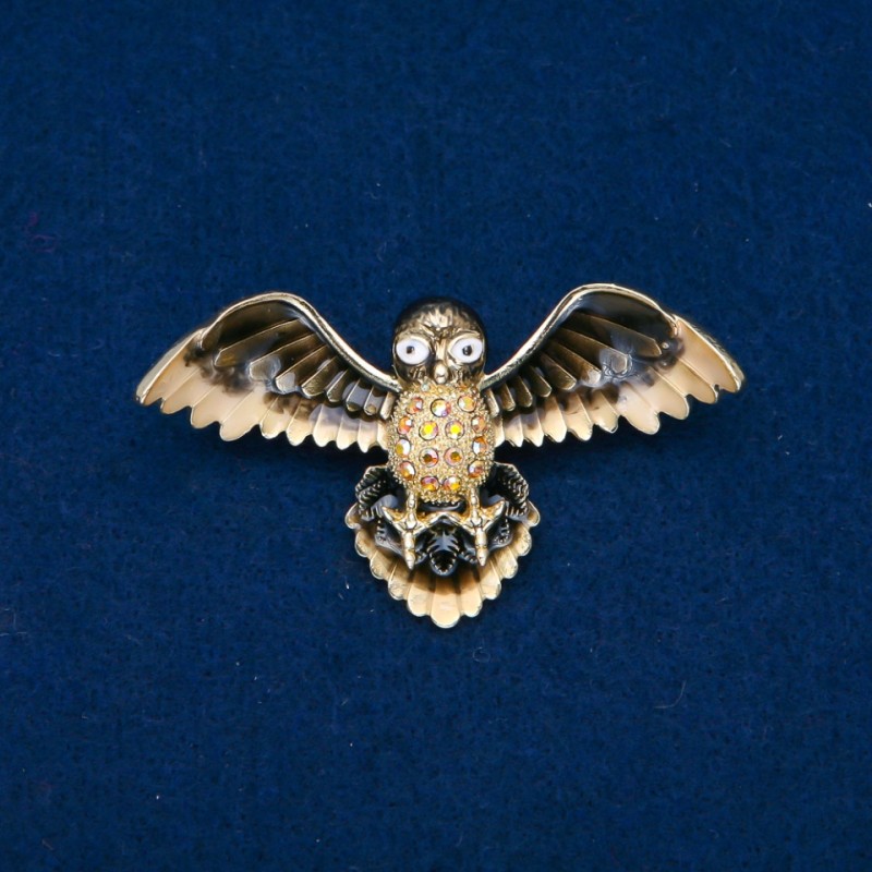 Brooch: Bird with enamel and golden gasoline rhinestones, golden metal 65x35mm +