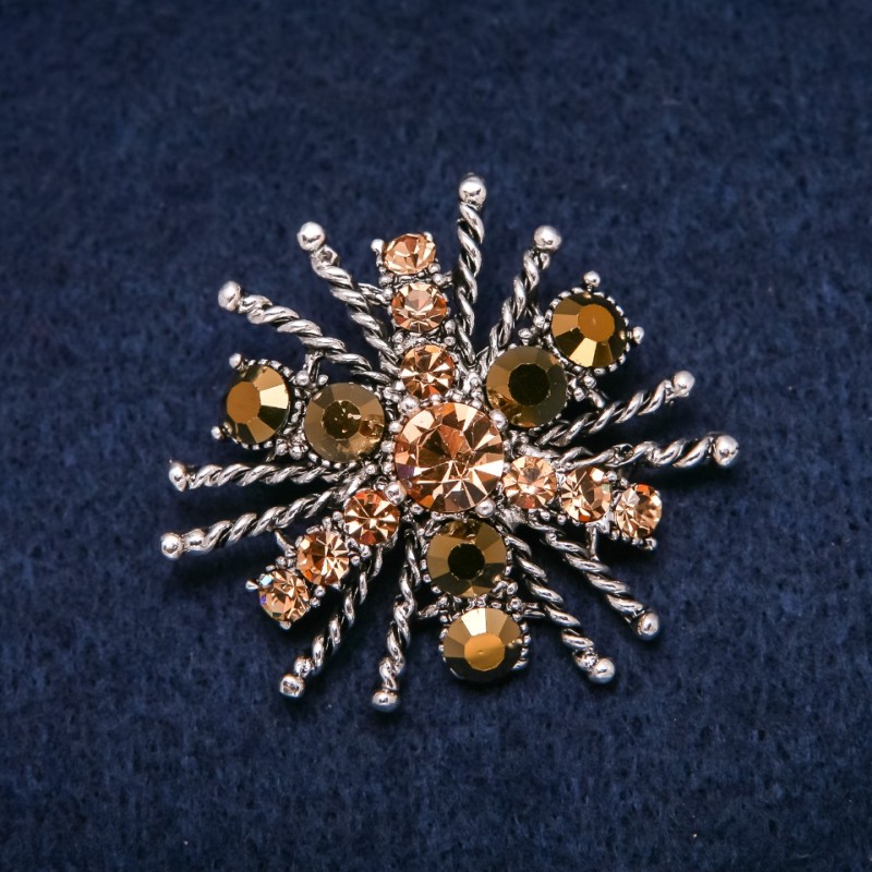 Brooch 'Order of Beauty' 45x40mm with yellow rhinestones, silver-tone metal