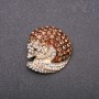 Brooch 'Nose-oha' in brown and white rhinestones on yellow metal 33x35mm