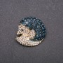Brooch 'Noseha' in blue and white crystals on yellow metal 33x35mm