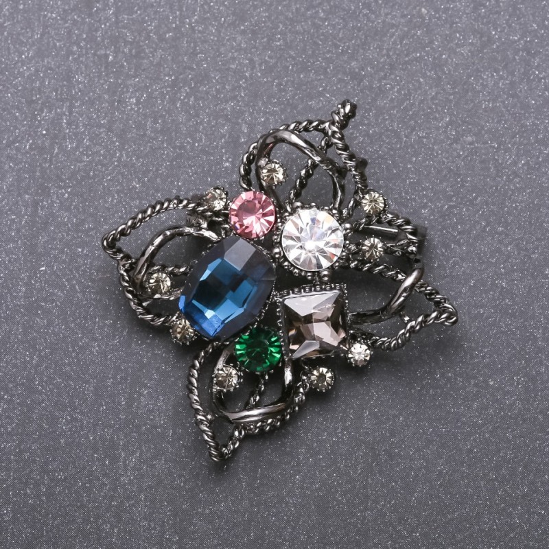 Brooch 'Order of Beauty' with Blue Crystal 51x48mm on Black Metal