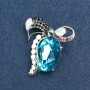 Brooch 'Bow' in silver-tone metal with rhinestones and a crystal 55x50 mm +