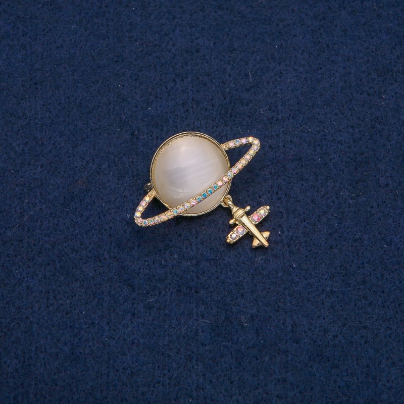 Brooch Saturn Cat's Eye (chatoyant) with golden metal and petrol colored rhinestones 35×20mm +