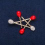 Brooch Star red enamel and white stones, gold-tone metal 36x44mm