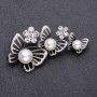 Brooch Butterfly with white beads garland 65x32mm metal