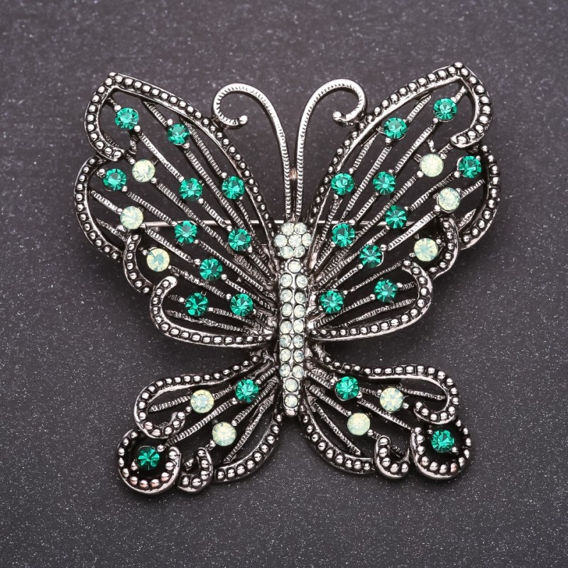Brooch Butterfly with green rhinestones 52x56mm gray metal