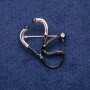 Brooch Scetoscope, white enamel black enamel 33x29 mm silver metal
