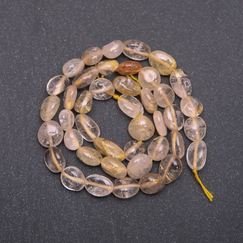 Rutilated quartz beads "hairsilk" golden faceted, diameter 8-10 mm (+/-) thread, length 38 cm