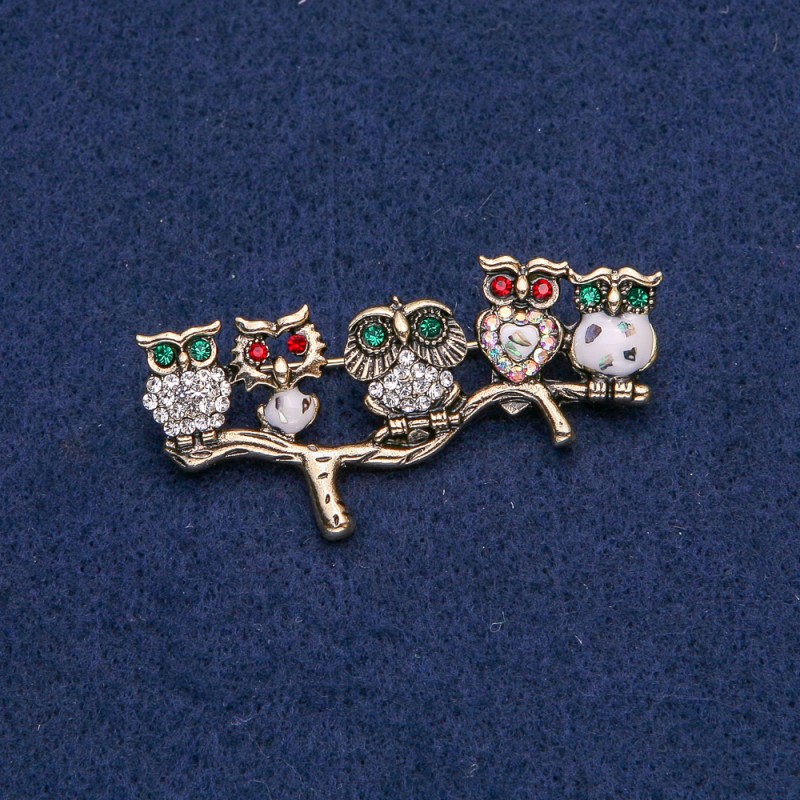 Brooch Owl in golden metal with white, Chadon, red and green crystals and halochosium 52x33mm +