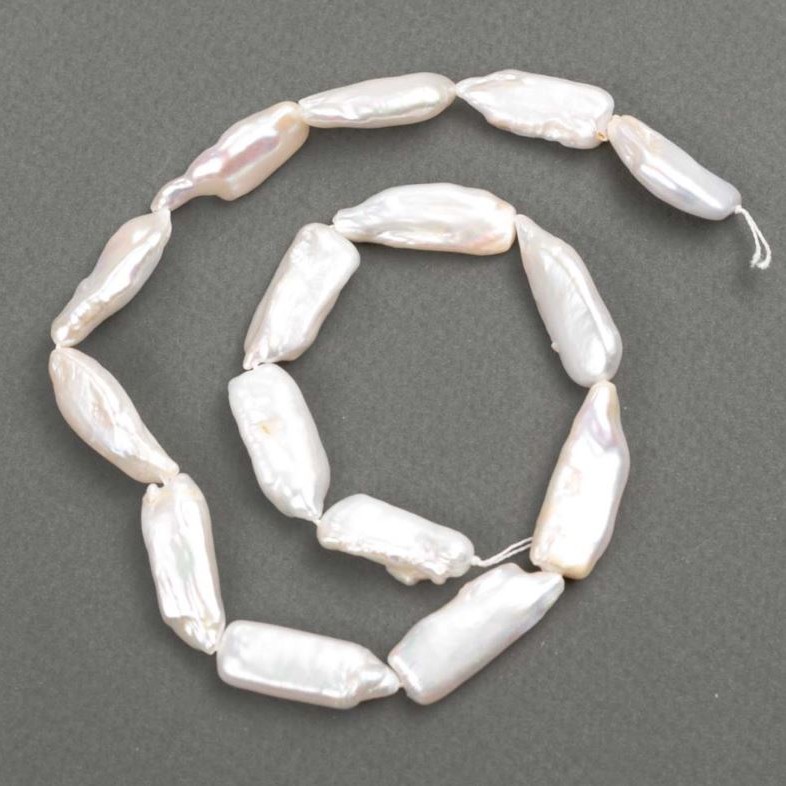 Baroque pearls with petrol shade on a thread d 26-32×10-11mm +-, length 39cm+
