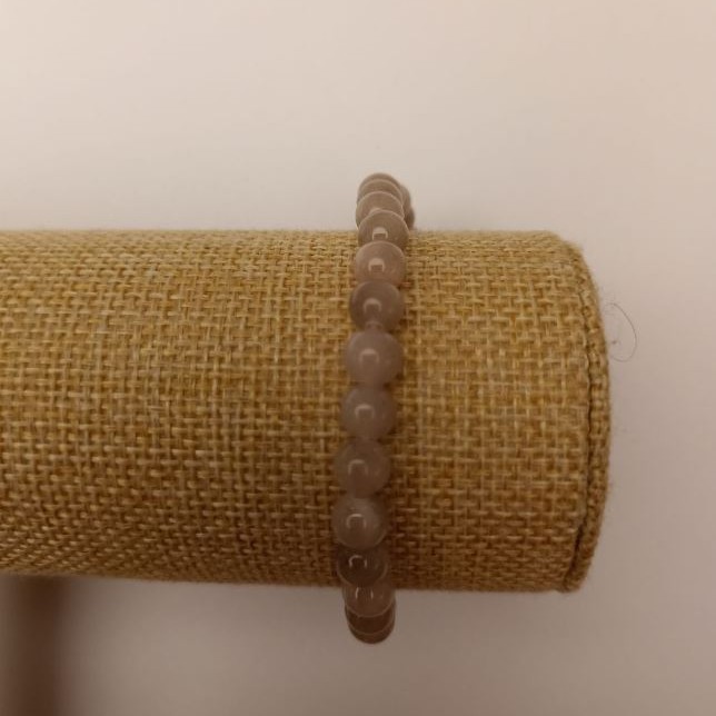 Bracelet on elastic Corded Quartz (artificial acrylic) gray smooth beads, diameter 6.5 mm ±, length 18 cm ±