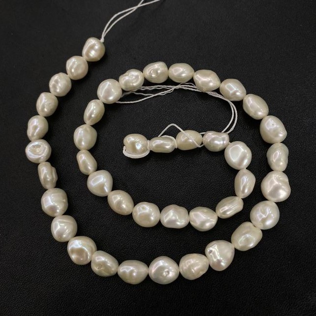 Freshwater Pearl Strand, 9x8mm diameter, 40 cm ± length with petrol iridescence