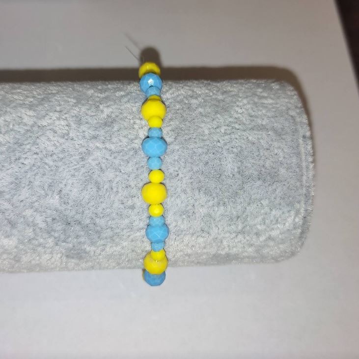 Bracelet "Ukraine" with Czech crystal "faceted rondelle" on elastic, diameter 6x4 mm +-, diameter 3x2 mm +-, length 18 cm+-