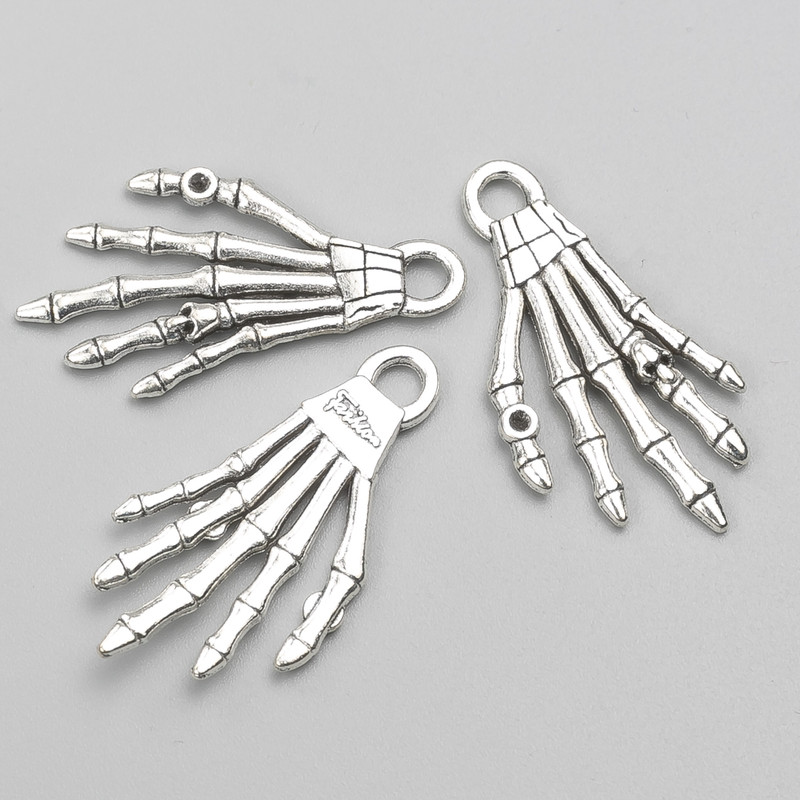 Pendant Findings “Skeleton Hand” 35×18 mm packaged 9 pcs +-. 20 grams