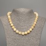 Necklace pale yellow “Selenite” smooth ball, diameter 10mm±, length 50cm±, made of white jadeite (synthetic dyed)