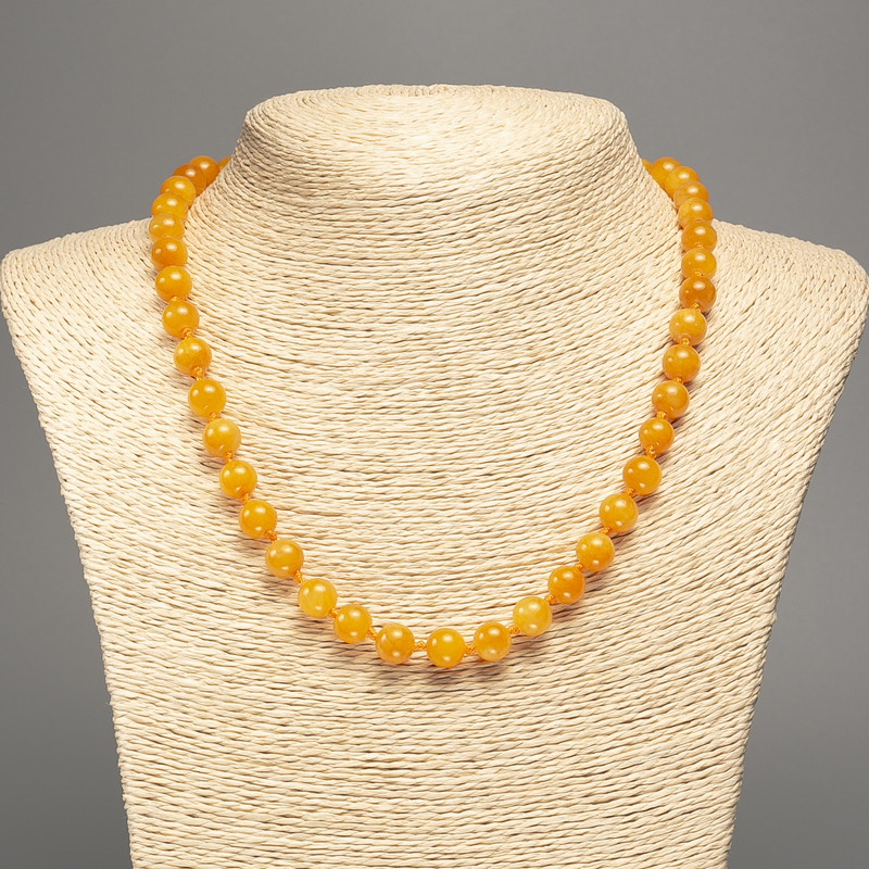 Necklace Amber-orange beads smooth ball diameter 8mm±, length 50cm±, made of white jade (synthetic dyed)