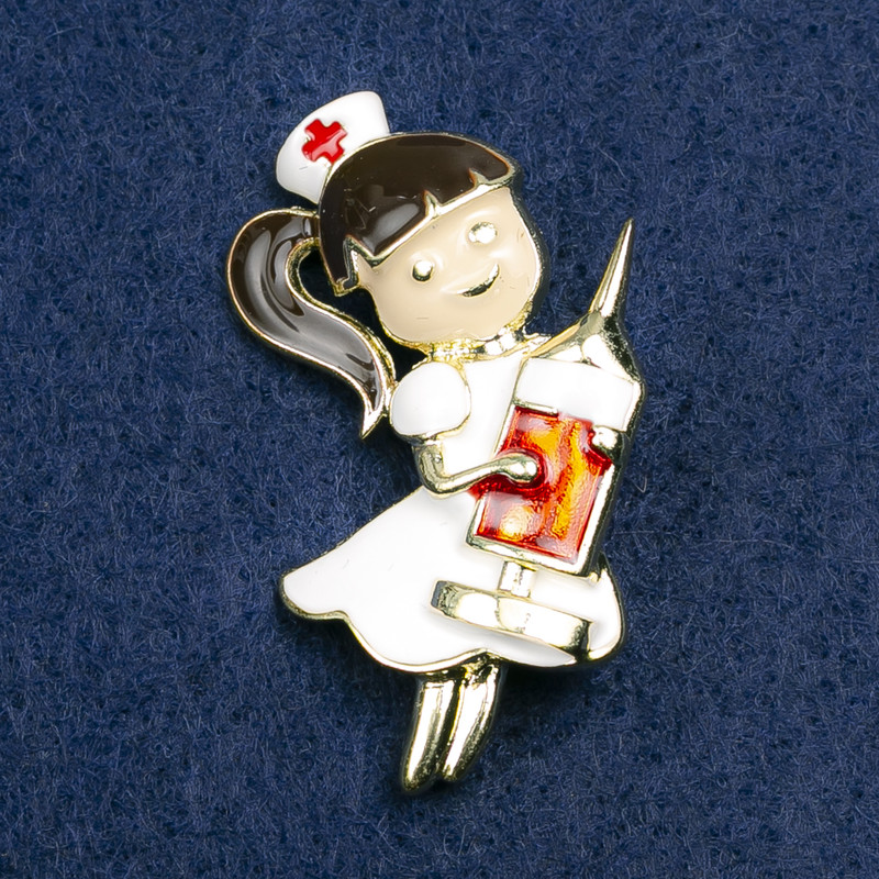 Brooch Nurse, white, black, and red enamel, gold-colored metal 42x31 mm