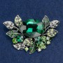 Brooch large Accent in floral design with crystals and green and white stones, silver metal, 67x46mm