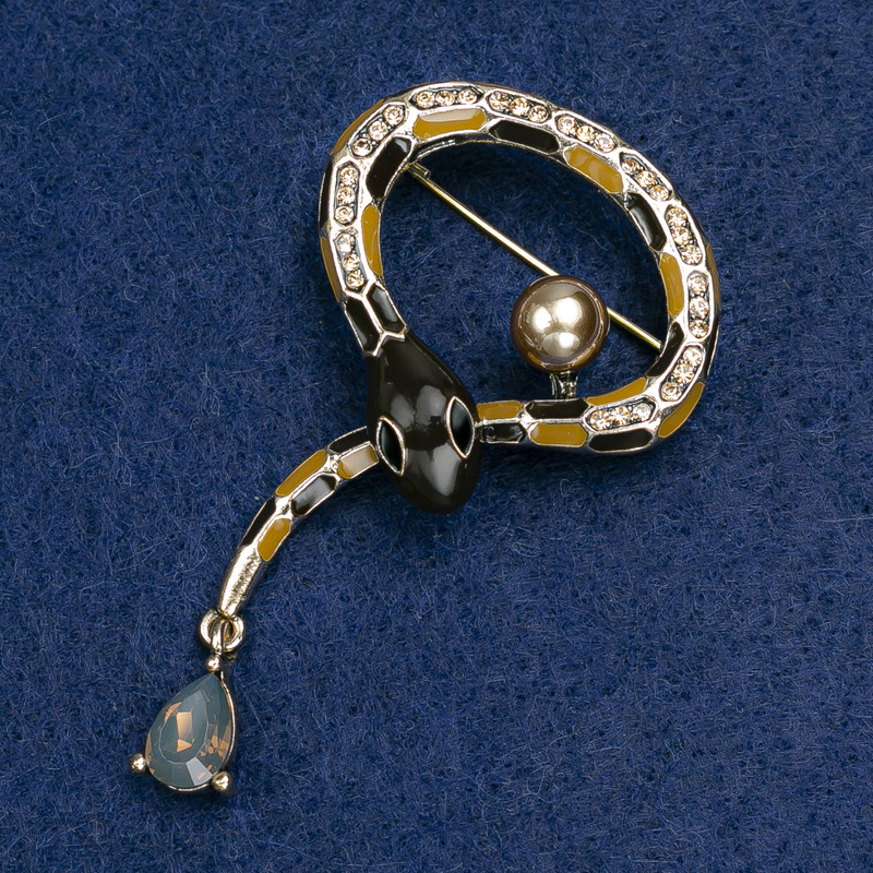Brooch Snake in black and brown enamel with a crystal, bead and golden rhinestones, golden metal 35x64mm