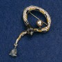 Brooch Snake in black and brown enamel with a crystal, bead and golden rhinestones, golden metal 35x64mm