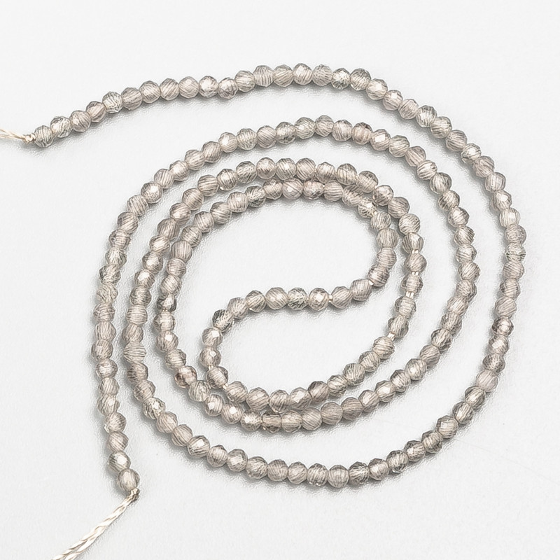 Small gray spinel beads (synthetic) faceted round 2 mm +/- on thread, length 37 cm