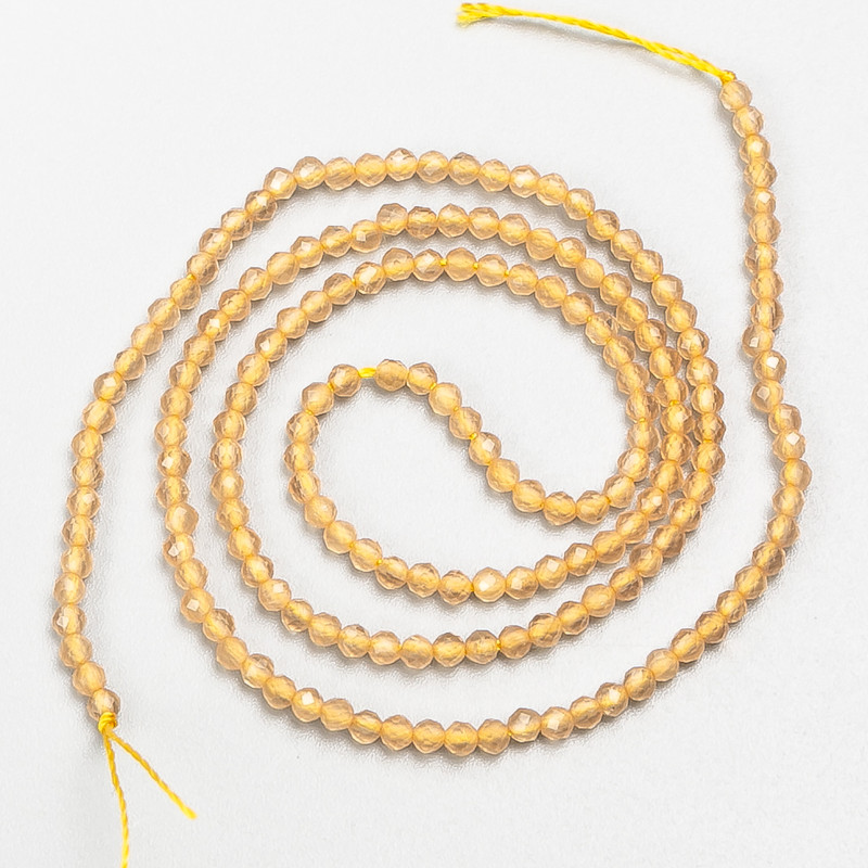 Small spinel beads (synthetic) beige faceted ball, diameter 2mm± on thread, length 37cm