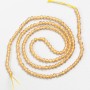 Small spinel beads (synthetic) beige faceted ball, diameter 2mm± on thread, length 37cm