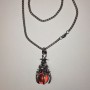 Pendant “Sphere in the Paw” orange 40×18 mm on a chain, approx 70 cm + - silver-colored metal