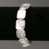 Bracelet with Baroque Pearls, rectangular shape, color tone “gasoline”, diameter 14x16mm±, length 18cm± (elastic)