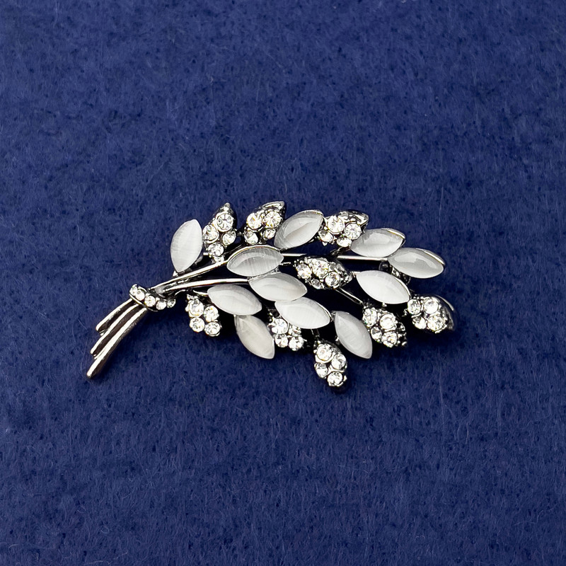 Brooch Branch of White Cat's Eye, white crystals, silver metal, diameter 50×27mm+