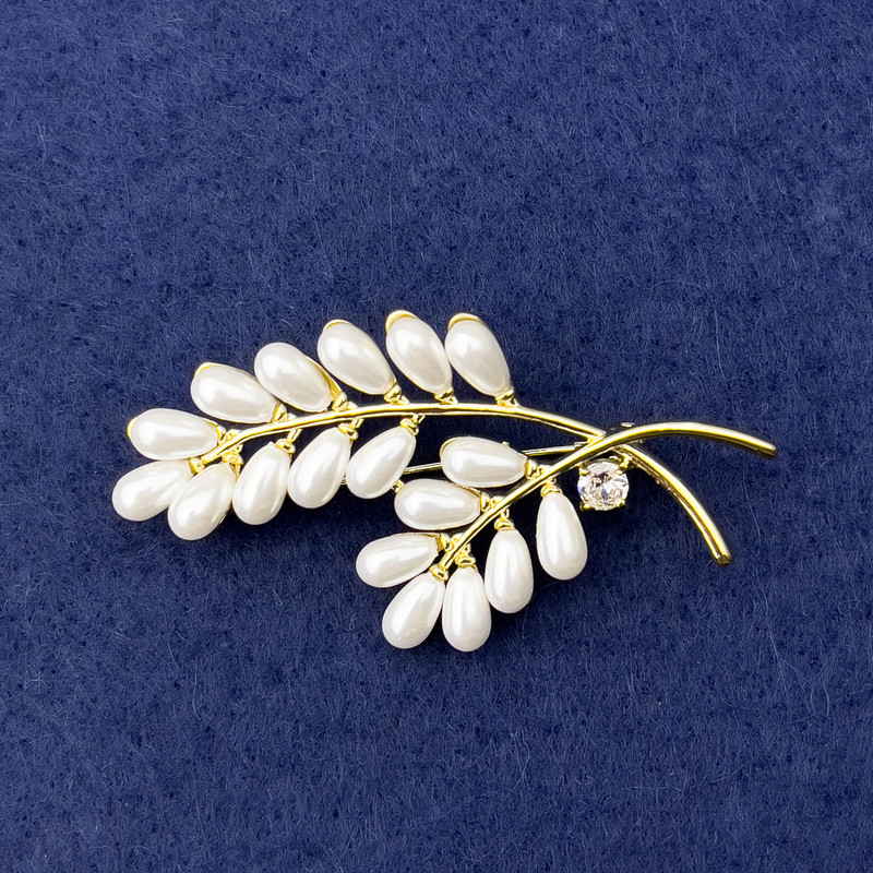 Brooch Branch with white pearls, crystal, gold metal, diameter 57x28mm+