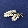 Brooch Branch with white pearls, crystal, gold metal, diameter 57x28mm+