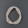 Oval freshwater pearls with a petrol tint on a thread, diameter 7x5mm±, length 39cm±