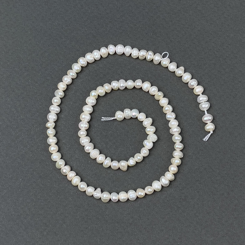 Freshwater pearls with a "gasoline" tint on a thread, diameter 5x4mm±, length 35cm±
