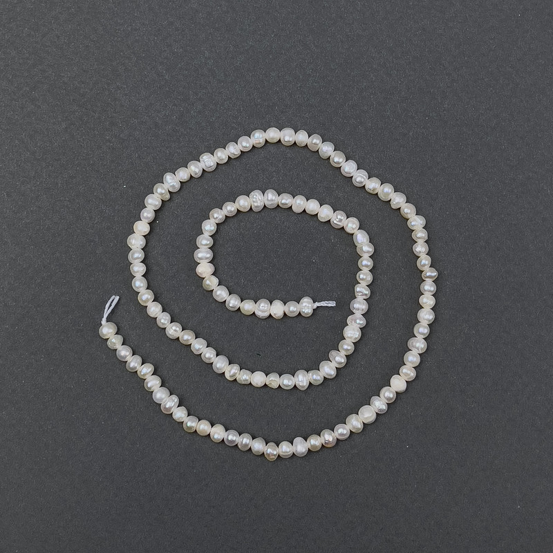 Oval freshwater pearls on a strand, 6x5 mm, length 35 cm