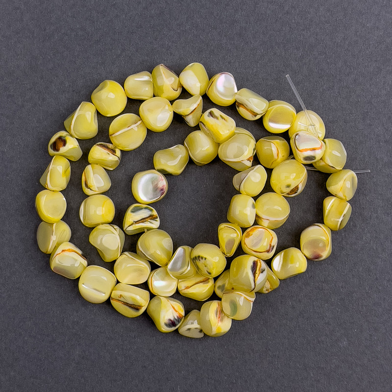 Toned beads—Yellow mother-of-pearl faceted, 8×6 mm, ~ 41 cm on thread
