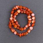 Tinted orange pearl beads faceted 8x6 mm, ± 41 cm nylon-coated necklace length