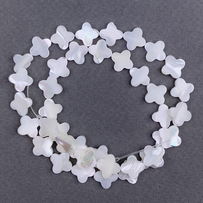 Pearlized crescent shaped beads (clover) 12×3 mm, 39 cm long on beading thread
