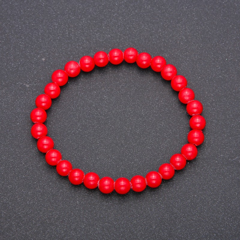 Bracelet made of natural coral on elastic with smooth beads, diameter 6(±)mm, length 18cm