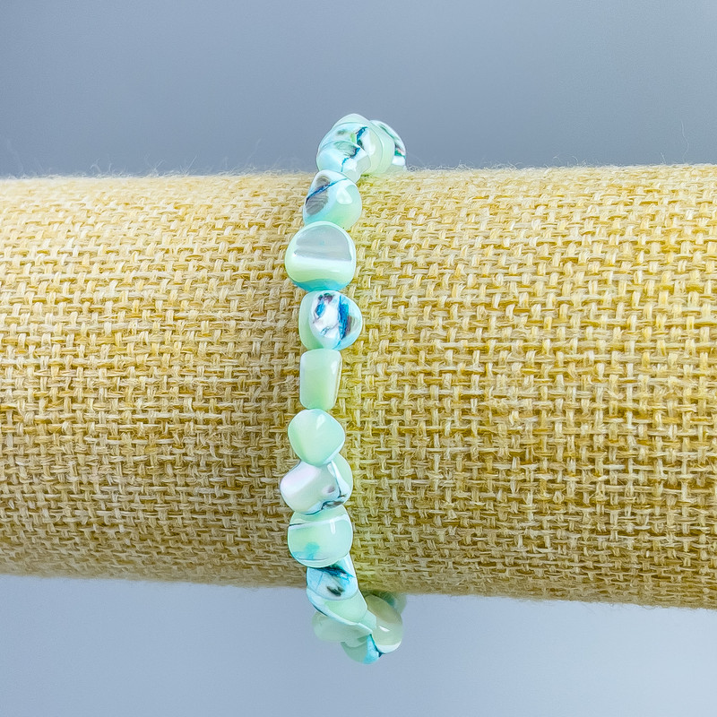 Bracelet Pearlized light blue faceted beads, diameter 8×6mm +-, length 18cm (stretch)