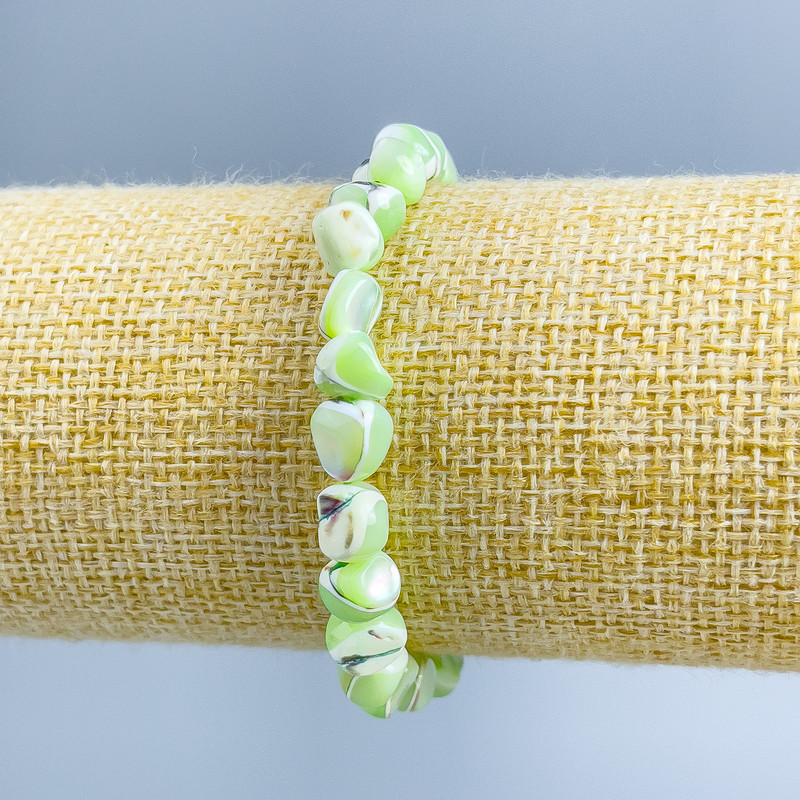Bracelet Mother-of-P pearl light-green faceted beads, diameter 8×6mm ±, length 18cm (stretch)