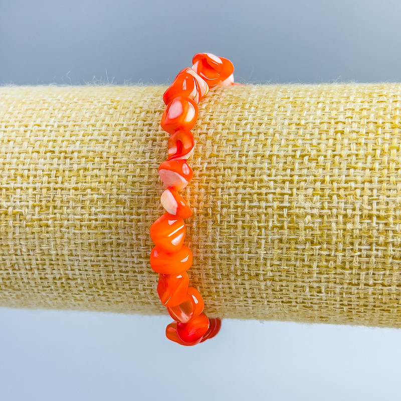 Bracelet with Orange Pearlized Pearl, faceted beads, diameter 8x6mm ±, length 18cm (stretch)