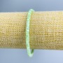 Bracelet with Turquoise-like light green toned mother-of-pearl disc, diameter 4x2mm, length 18cm (stretch)