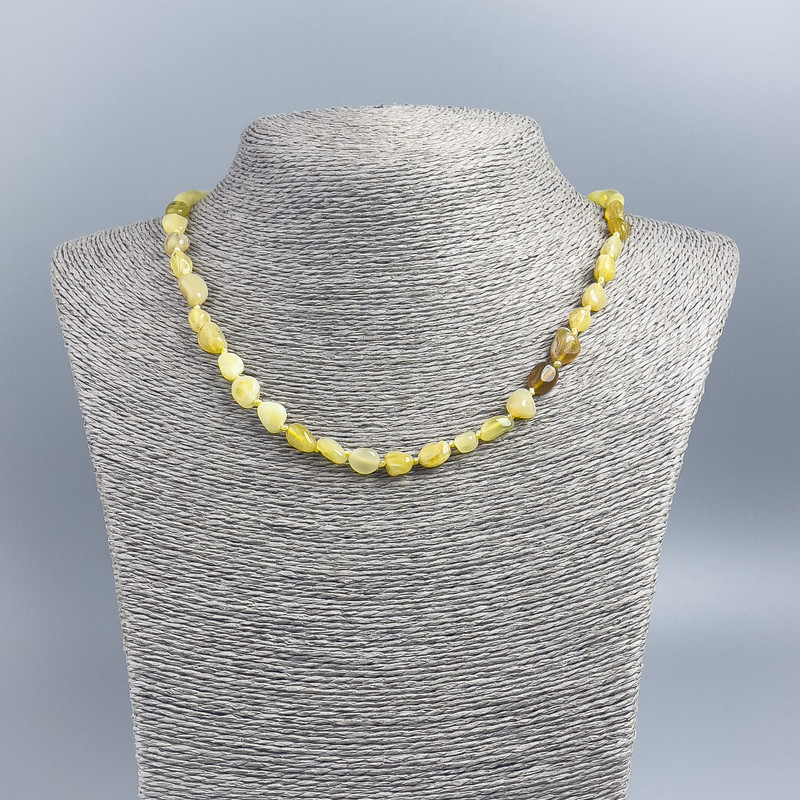 Citrine Beads with opaque faceted stones, 7x10 mm, length 50 cm