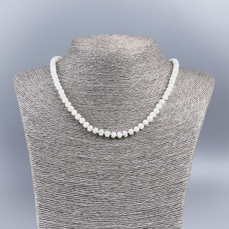 Necklace of natural white mother-of-pearl rondelles, diameter 6x4mm ±, length 50cm ±