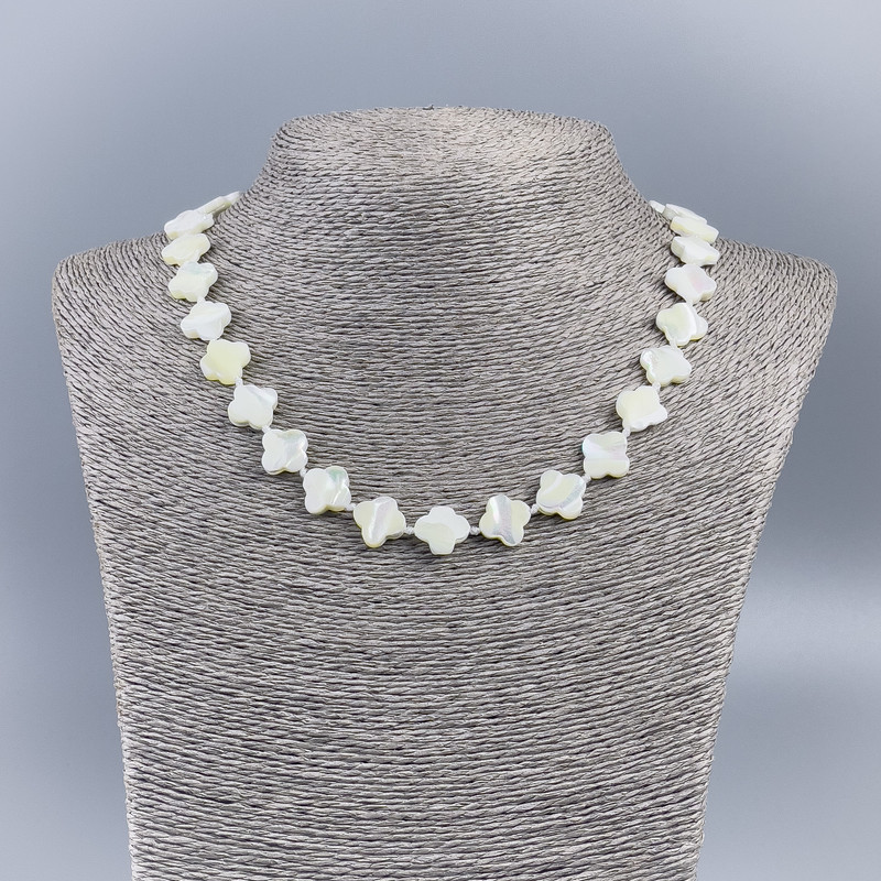 Necklace made of natural white mother-of-pearl in a shamrock shape, diameter 11x13x3mm+-, length 50cm+-