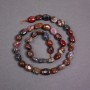 Petersite Beads on a Thread, Natural Stone Tumbled, 7×10 mm, ± length 38 cm