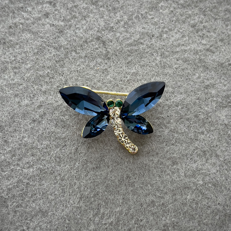 Brooch Butterfly with blue and white crystals on golden metal 20x28 mm+