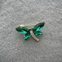 Brooch 'Butterfly' with green and white crystals on golden metal 20x28 mm