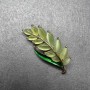 Brooch Branch with green cat's eye and green enamel on golden metal 22x47mm